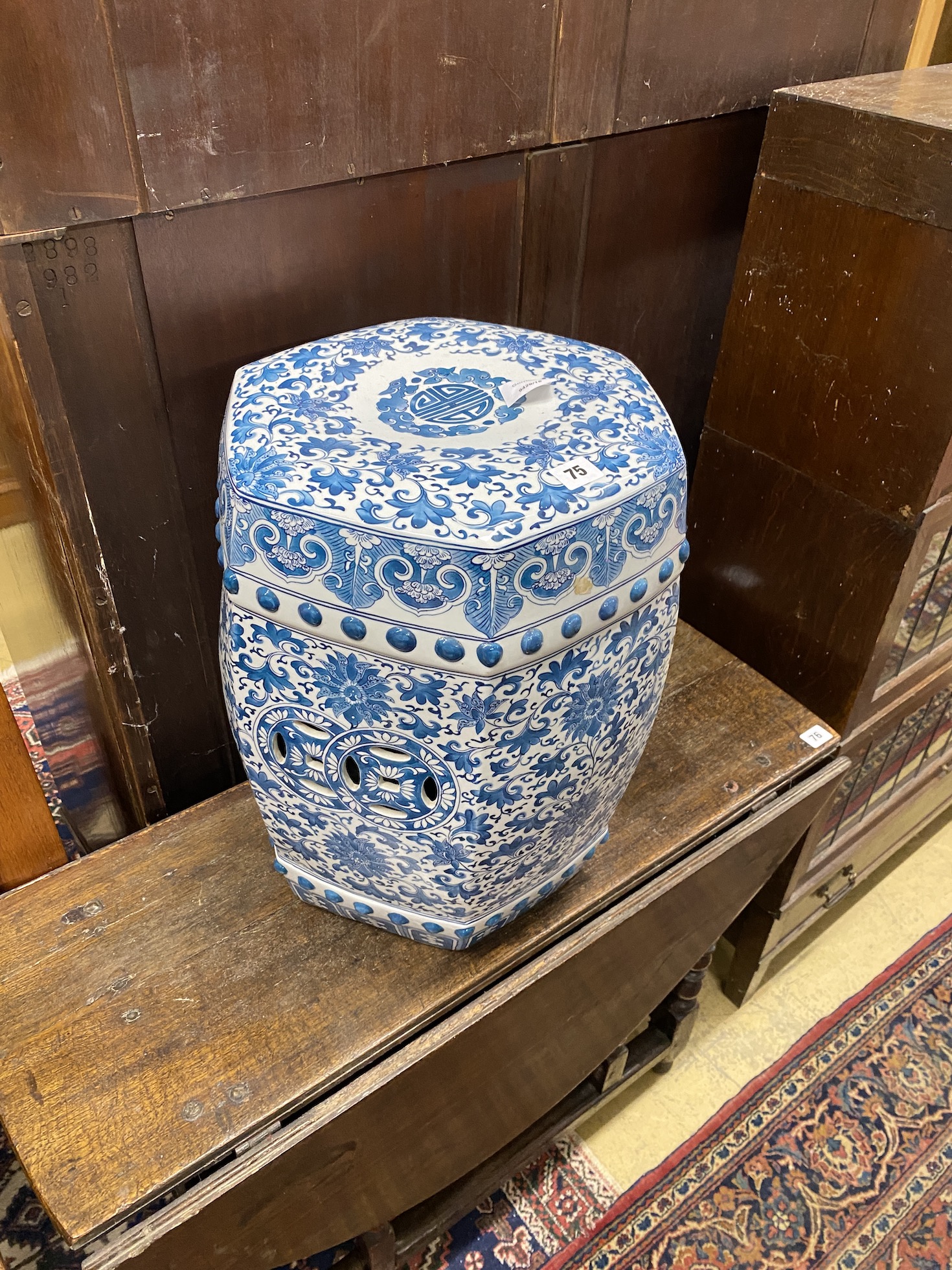 A Chinese hexagonal blue and white porcelain garden seat, height 46cm